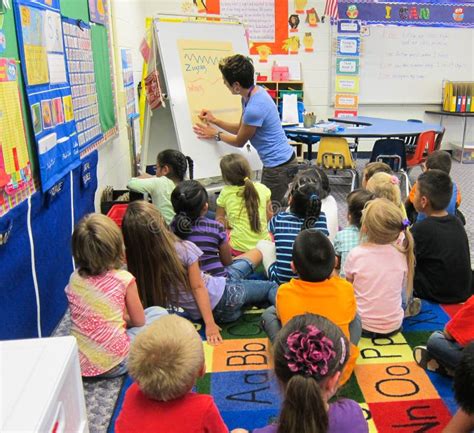 Children Studying In A Kindergarten Classroom With A Teacher Editorial