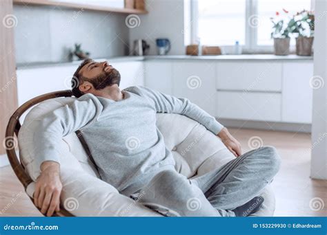 Close Up Man Relaxing In A Comfortable Chair Stock Photo Image Of