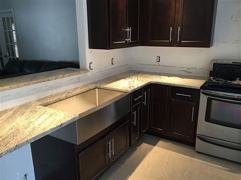 I know that i don't like black appliances for sure, so i guess the choice is between stainless and white. Colonial Ivory Granite Countertops Installation Kitchen