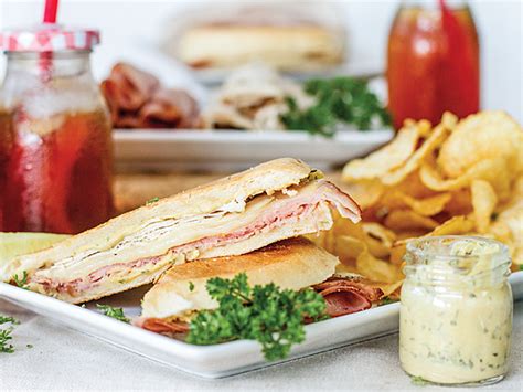 Arrange the swiss cheese over the ham, and top with remaining ham slices in a layer. Ham-and-Swiss panini with herb mustard - www.scliving.coop