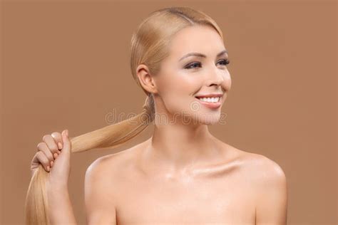 Naked Blonde Girl Takes Off Red Panties In The Bathroom Stock Image