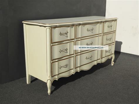 This post contains affiliate links, to learn more, see my disclosure statement. Vintage French Provincial Dixie Off White & Gold Triple Dresser Brass Hardware