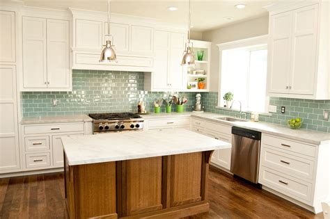 A subway tile kitchen backsplash made up of glass brightens up this kitchen with style. 17-subway-tile-green-glass-kitchen-backsplash-white ...