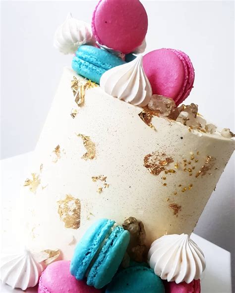 Vanilla Bean Cake With Pink And Blue Macs Meringues Gold Leaf And