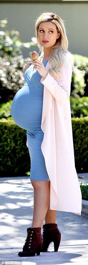 pregnant holly madison displays her huge bump in tight blue dress tight blue dress blue
