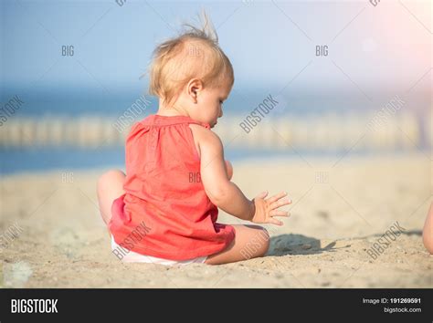 Baby Playing On Sandy Image And Photo Free Trial Bigstock