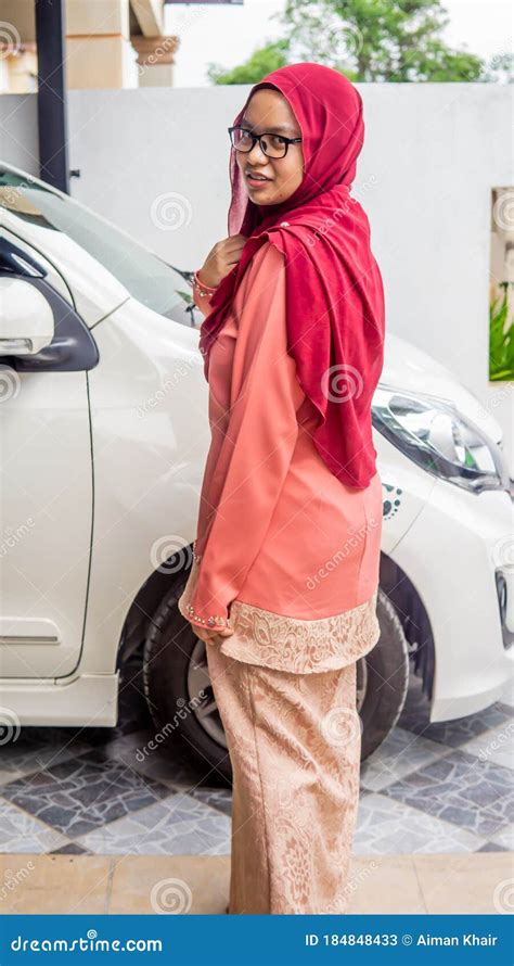 A Portrait Of Beautiful Young Muslim Malay Woman Wearing A Hijab And Traditional Dress Called