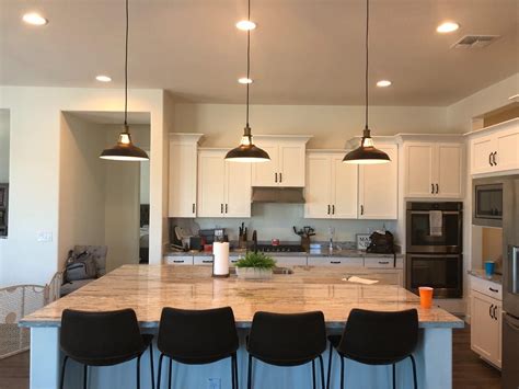How do you hang pendants over kitchen pendant lighting kitchen island industrial ideas. A large kitchen island with our classic black metal barn ...