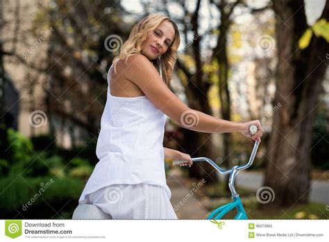 Composite Image Of Digital Composite Image Of Blonde Going On A Bike Ride Stock Image Image Of