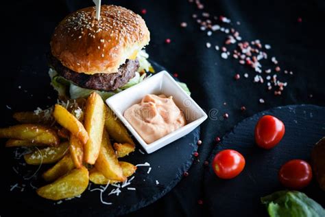 Home Made Burgers With Delicious French Fries And Spicy Mayonnaise Sauce