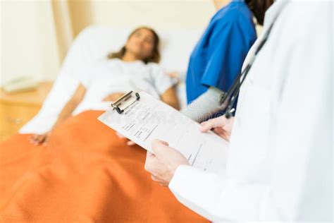 Doctor Treating Female Patient Stock Photo Image Of Diagnosis Young