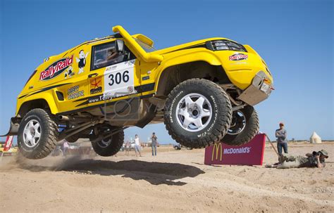 Off Road Trucks Competing In A Desert Rally By Paulvinten Vectors