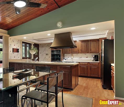 Modern day indian couples are hard pressed for time. open modular kitchen design with service counter - GharExpert