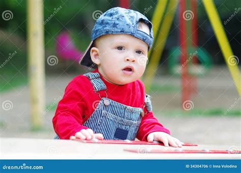 Lovely Baby On Playground In Summertime Stock Photo Image Of Walking