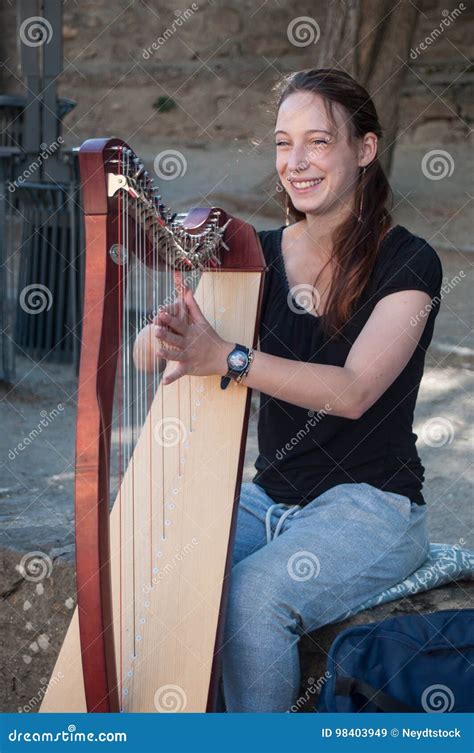 Woman Playing Harp In The Street In The Medieval Fortifications