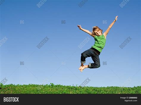 Happy Child Jumping Joy Image And Photo Bigstock