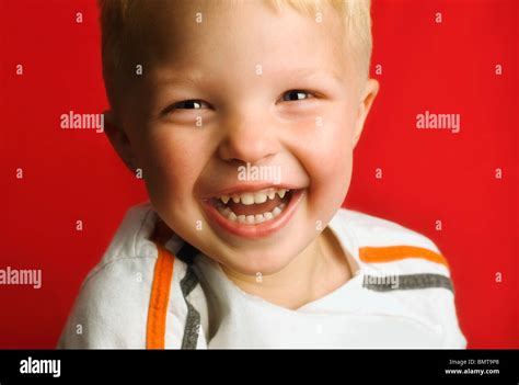 A Young Boy Laughing Stock Photo Alamy