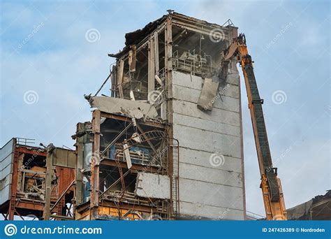 Hydraulic Scissors Destroy Abandoned Industrial Building Stock Image