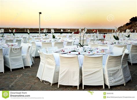 To avoid hiding a utensil under the rim of a plate or bowl, lay it approximately one (1) inch away from the plate's side. Table Set Up At The Beach Wedding Royalty Free Stock Photo ...
