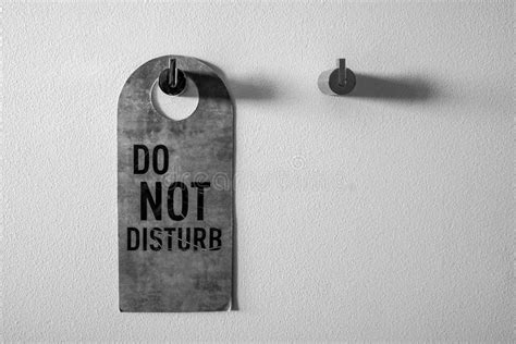 Do Not Disturb Sign On The White Wall Stock Photo Image Of Hang