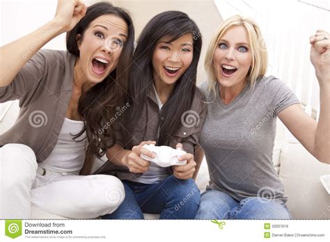 Dress her up in chic clothes for the rest o. Beautiful Women Friends Playing Video Games Stock Image ...