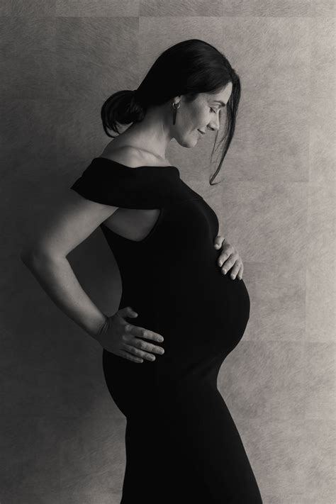 Maternity Photograph Mother In A Black Dress Indoor Maternity