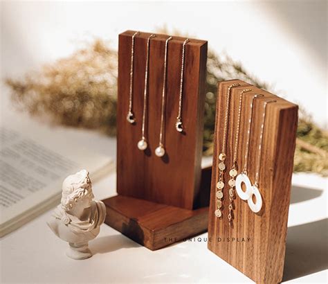 A Walnut Wood Jewelry Display Stand And The Perfect Accessory To