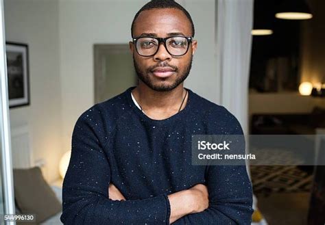 Handsome Young Black Man Looking At Camera At Home Stock Photo