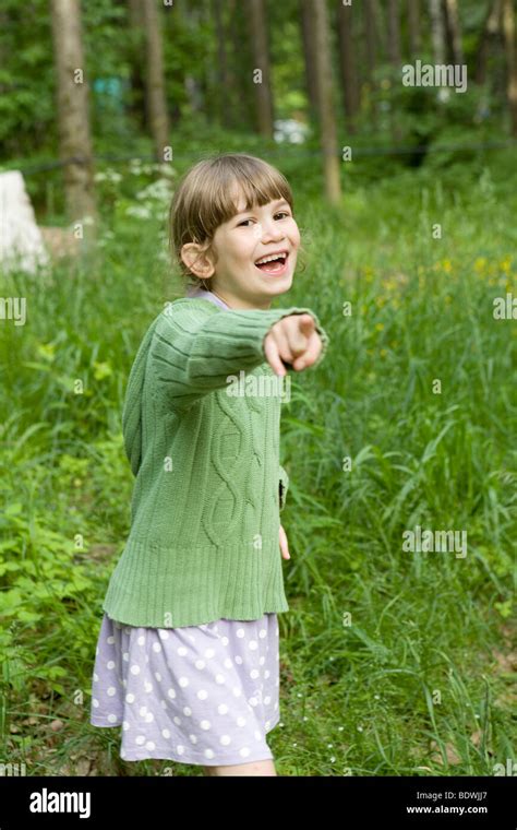 Cute Girl Eight Years Old Show On Someone Stock Photo Alamy