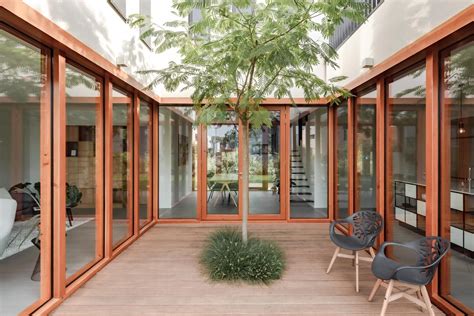 Glass Walls Wrap Around The Inner Courtyard Of This Home Courtyard