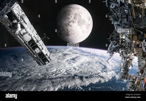 Space Stations On Background Of The Moon View From The Orbit Of Earth