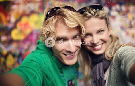 Beautiful Young Couple Taking Selfie Of Themselves Royalty Free Stock Image Storyblocks