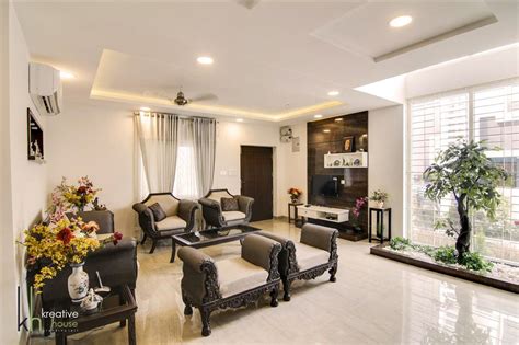 BUDHA MURAL AND BODHI TREE THEMED INTERIORS FOR A VILLA IN HYDERABAD