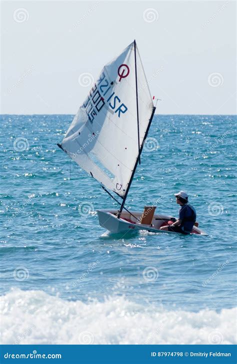 Young Athlete Trains On An Entry Level Sports Sailing Boat Editorial