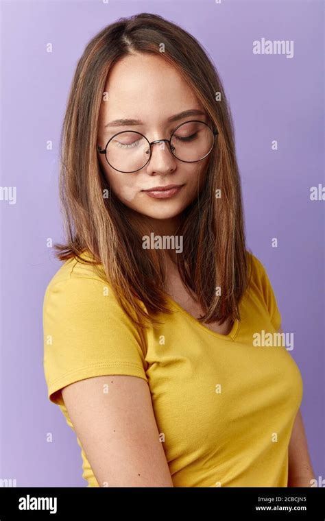 Shy Girl In Round Glasses Looking Down Close Up Portrait Isolated