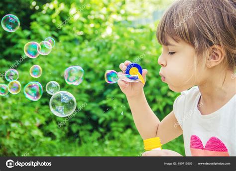 Children Blowing Bubbles Selective Focus Stock Photo By ©yana