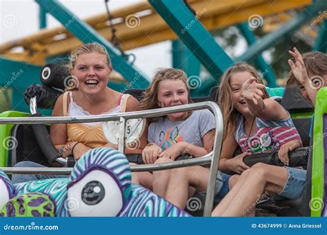 girls on carnival ride at state fair editorial stock image image of