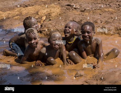 Nyangatom Kids Playing In Muddy Water Kangate Omo Valley Ethiopia