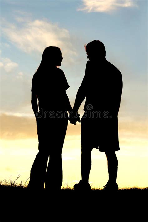 Download image as a png. Silhouette Of Happy Couple Holding Hands And Talking At ...