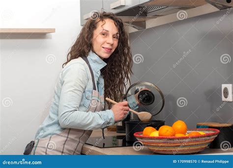 Young Woman With Long Hair Is In The Kitchen Stock Photo Image Of