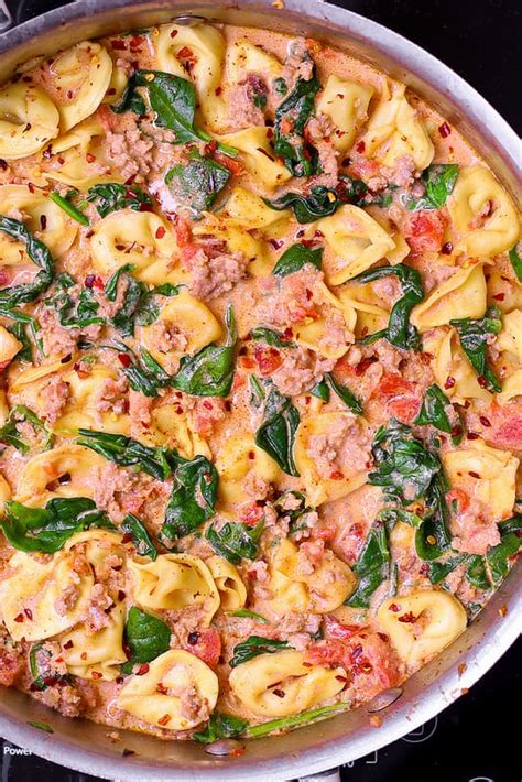Spoon over the spaghetti mixture. CREAMY SAUSAGE TORTELLINI WITH SPINACH, TOMATOES AND ...