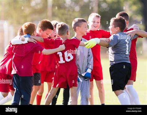 Kids Soccer Football Young Children Players Celebrating In Hug After