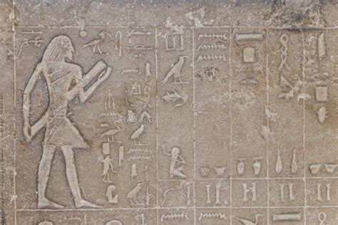 Ancient Egyptian Paintings And Hieroglyphs Carved On Stone Wall