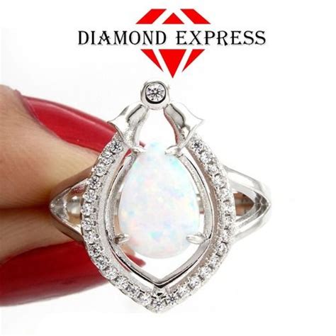 Engagement rings were meant to hold value as insurance for backing out of the commitment. 18K Gold Pear Shaped Opal & Halo Engagement Ring. Starting at $1 | Engagement rings, Selling ...