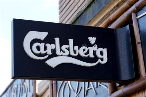 Carlsberg Text Brand And Sign Logo Of Beer Front Of Bar Restaurant In