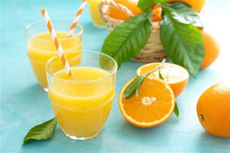 Orange Freshly Squeezed Juice In Glass And Fresh Fruits Stock Image
