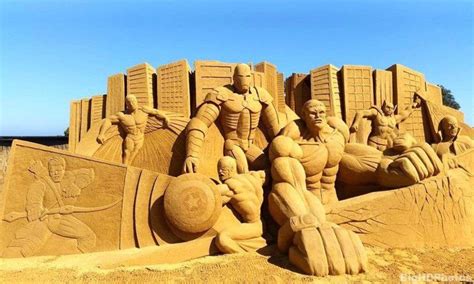 a sand castle made to look like it is in the shape of a man and woman