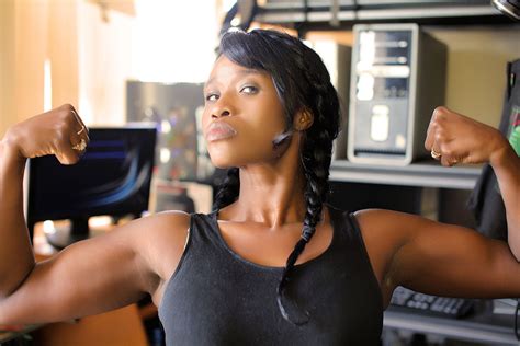 Strong Woman Flexing Biceps Muscles