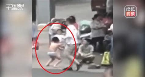 Chinese Mom Makes Son Strip To His Underwear And Squat In Public For