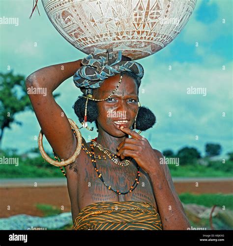 Fulani Milk Maid Calabash With Hand Incised Decoration Balanced On Her On Head Note Facial